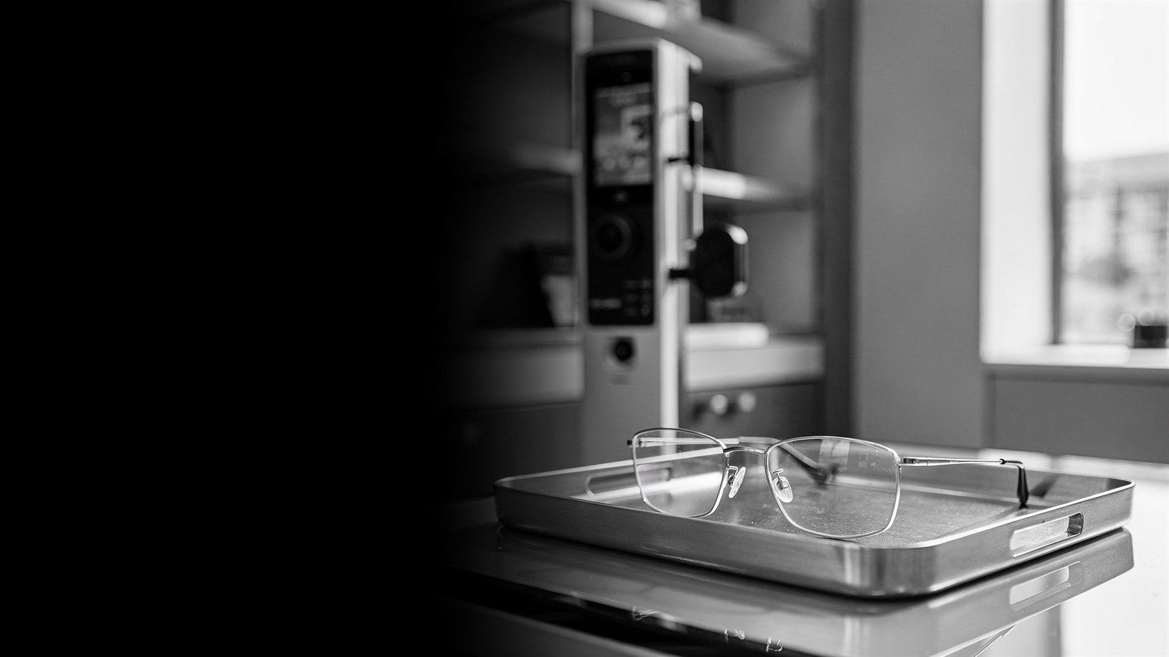 Titanium spectacle frames on a steel instrument tray