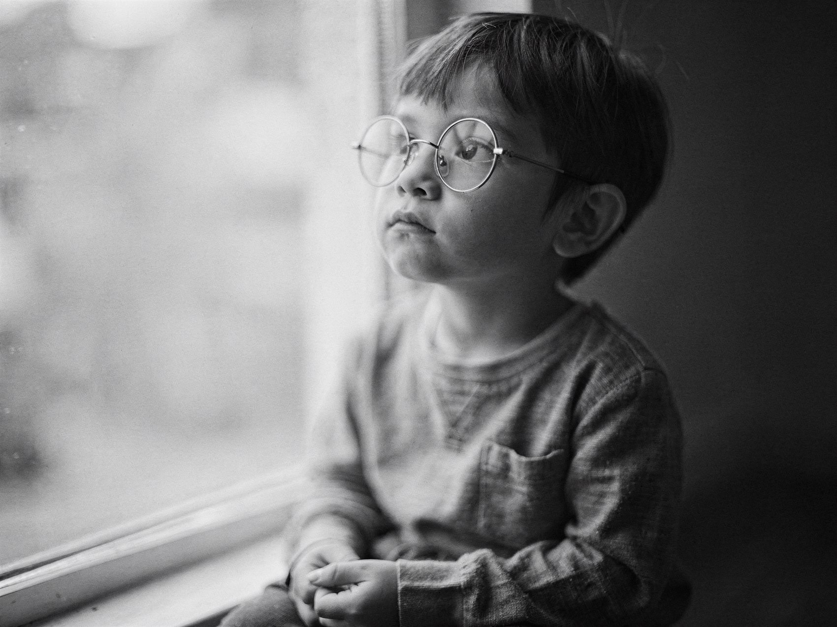 A child wearing round spectacles fitted for myopia control at AZ Optics Centre