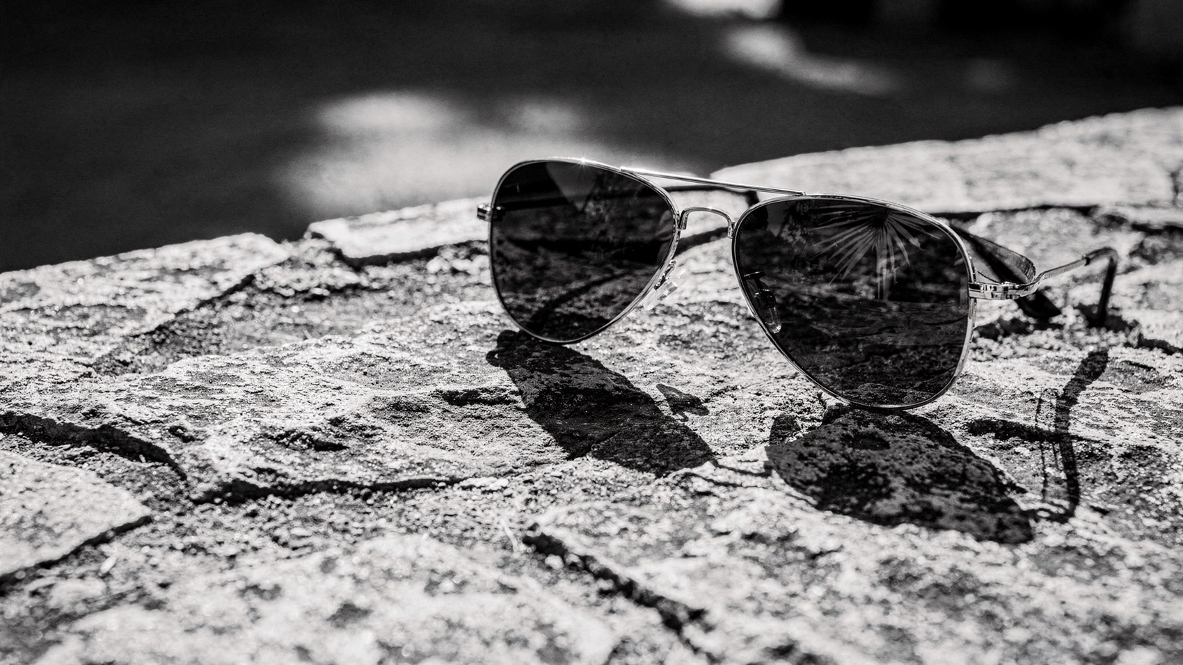 Pilot-style sunglasses in hard tropical sunlight